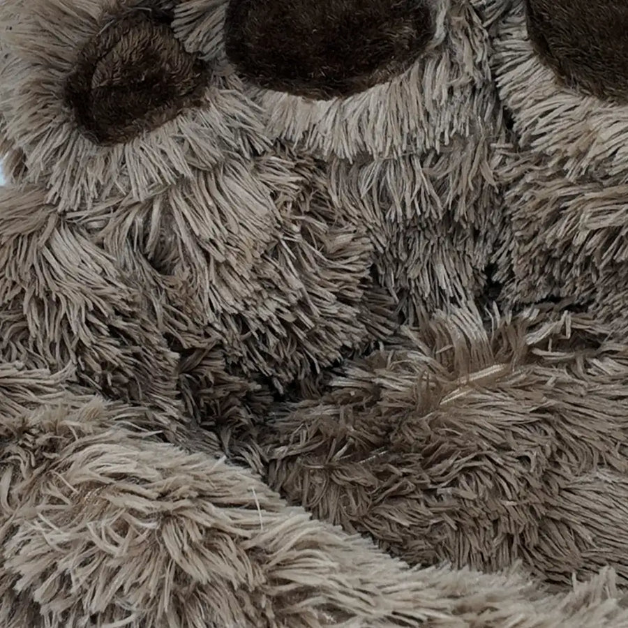Close-up of a fluffy, Bear Paw Shape Plush Pet Nest Sofa Bed with textured fur.