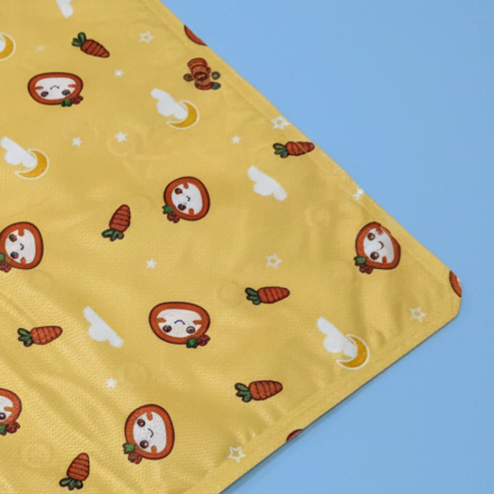 Yellow Pet Cooling Mat with cartoon character pattern on a blue background